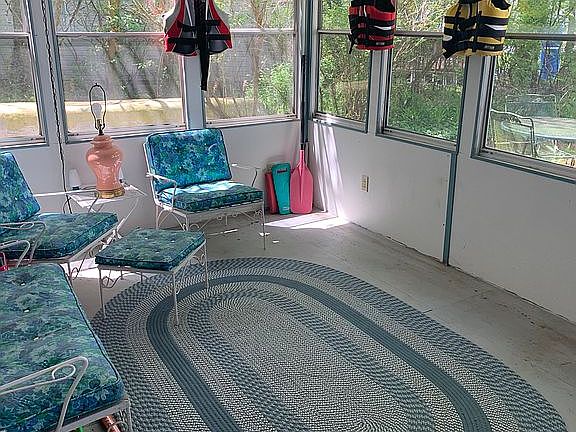 Screened porch/sunroom. 