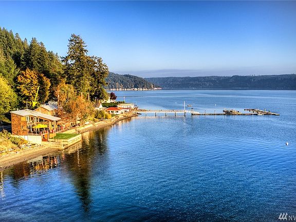 View of the boat house on the water's edge.