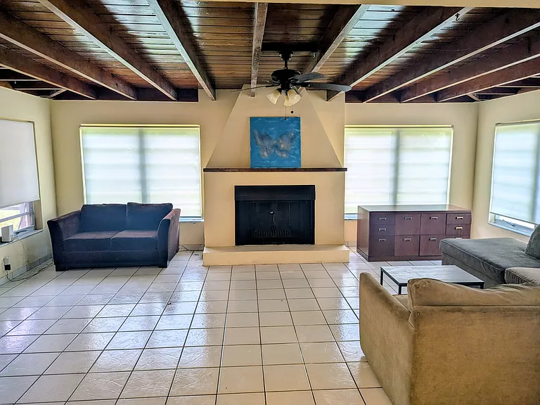 Available furnished with couch, sectional, coffee table, and credenza