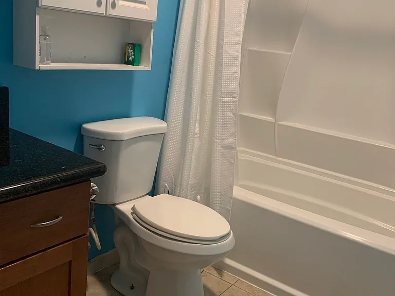 Both bathrooms include shower/tubs