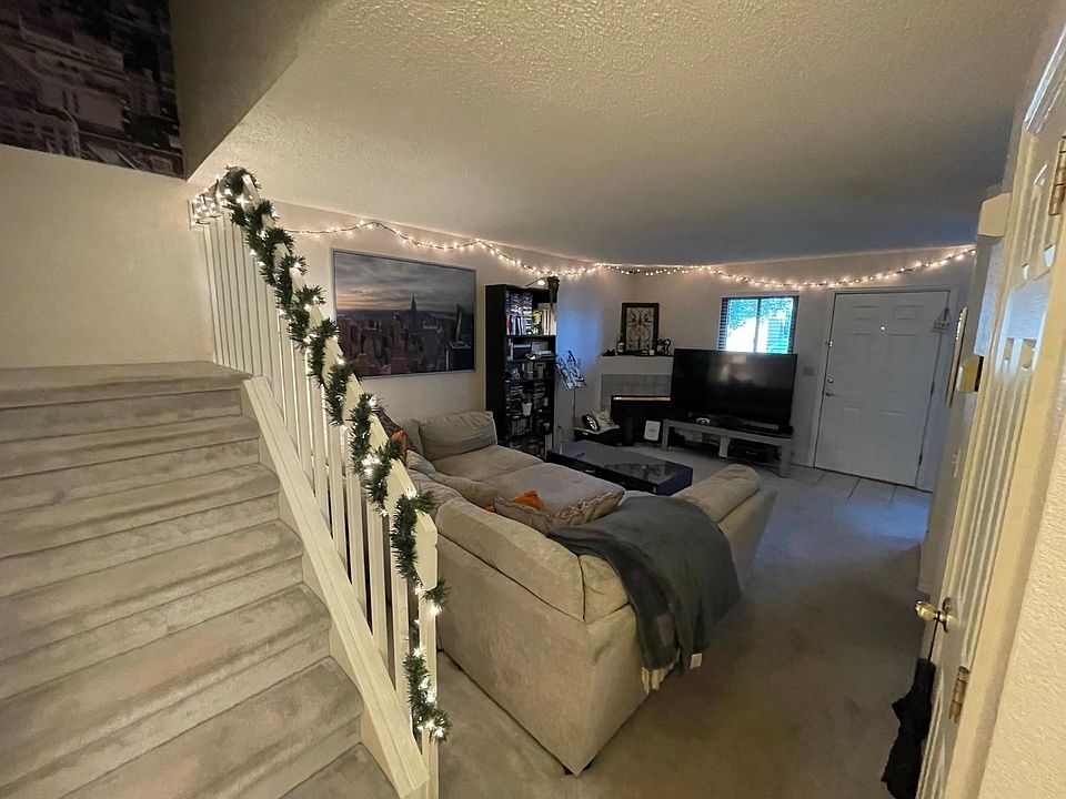 Large Room with Tile Entryway. Stay cozy with illuminating log gas fireplace.