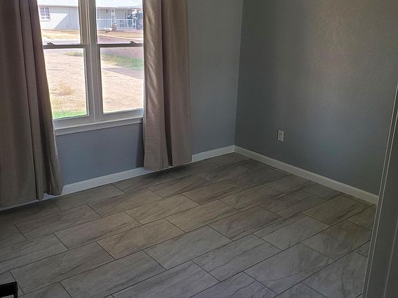 Entryway to the second bedroom. New ceiling fan.
