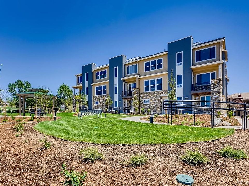 Front of unit, includes open space and picnic area