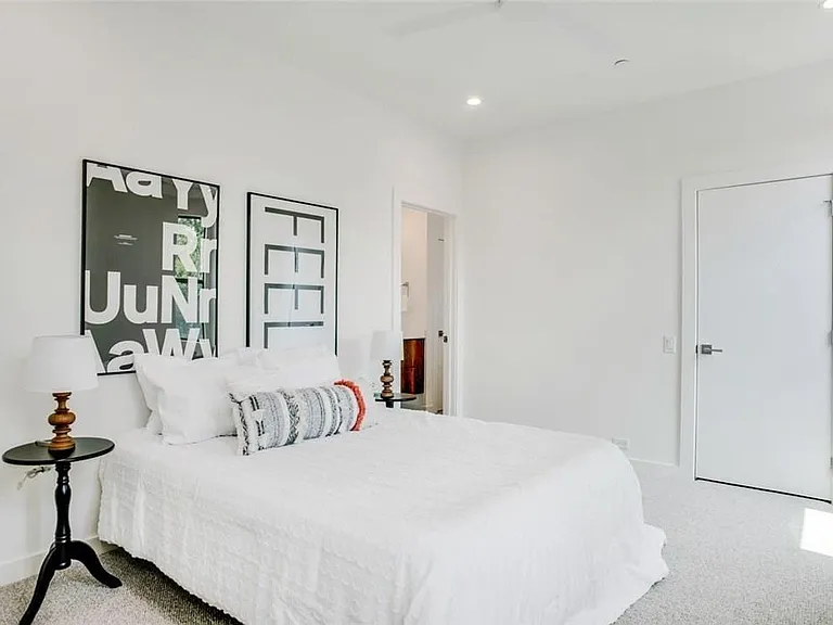 Bright room with light-toned carpeting and white walls