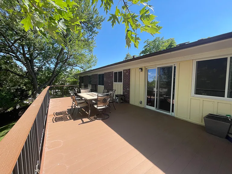 13" x 30' Nexan water tight low maintenance aluminum decking with steel railings - Sliding glass door from kitchen/living room area to deck with a view. The deck is fully permitted with the City of Lakewood.