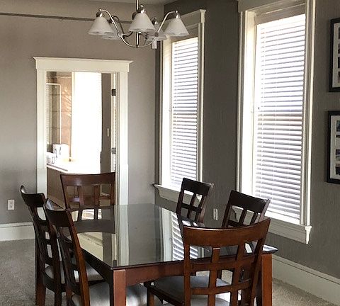 Large great-room feel lined with floor-to-ceiling windows.