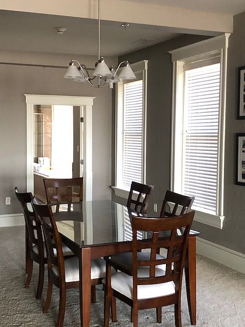 Large great-room feel lined with floor-to-ceiling windows.