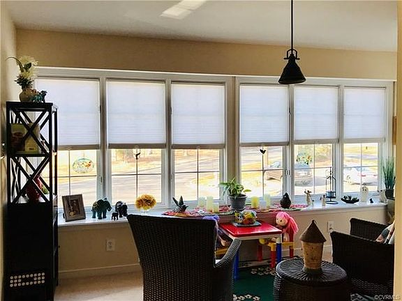 Sun room with wall of windows.