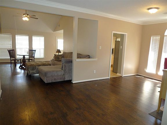 Nice open view of living room and dining room when you enter. You'll enjoy the Hand Scraped wood laminate floors