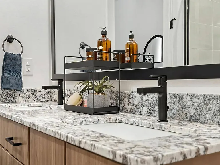 Double Bathroom Vanities with Granite Countertops and Dual Mirrors