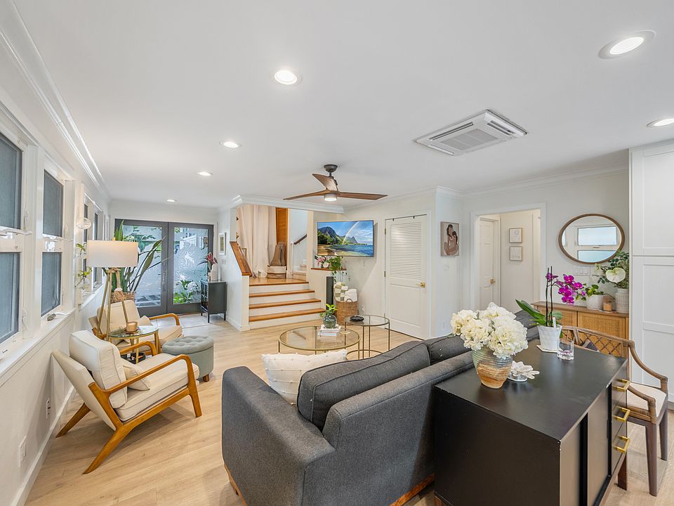 Great room with living area and kitchen is perfect for entertaining. AC throughout the home, ceiling fans, tons of natural light. Stairs to optional 1 bedroom ohana and massive primary suite (with rooftop lanai).