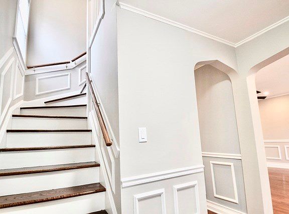 View of staircase to 2nd level from entry foyer