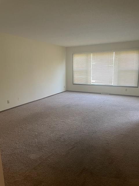 Large living room with new carpet to be installed.
