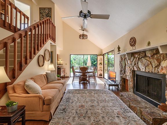 Open Living room and dining area with fireplace