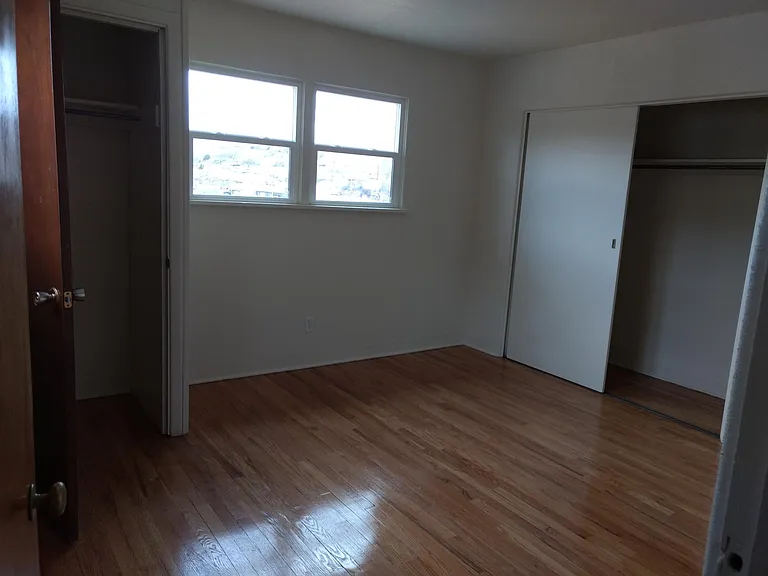bedroom with 2 closets