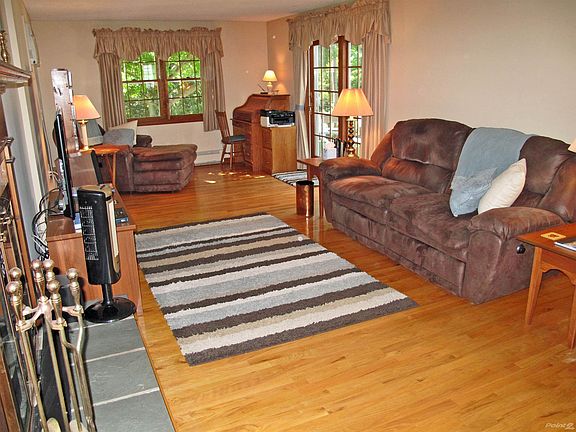 The Family Room, as well as the entire home, features hardwood floors. The slider leads to that terrific deck.