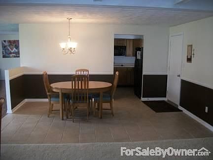 Dining Room
						:
						Open concept into extra room, as well as to the living room.