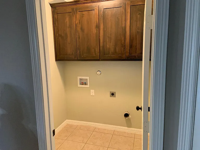 Washer and dryer connections off kitchen area