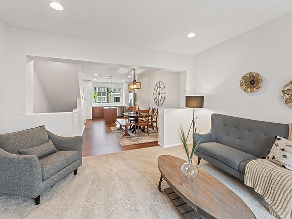 Good size living room fits large sectional couches, or separate couch and chairs. with cornered fireplace makes for cozy setting and great for furniture placement. Slider to private deck