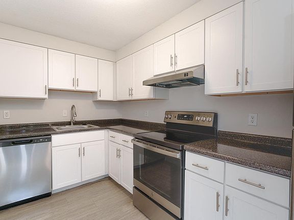 Modern kitchen style with updated white cabinetry and sleek stainless-steel appliances, creating a fresh, clean look.