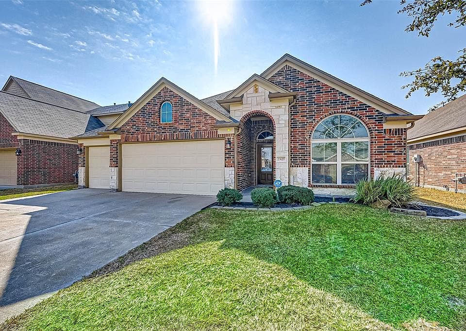 Welcome to this awesome home at 23127 Quiet Heron Court in Morton Creek Ranch! The home offers 4 bedrooms, 2 baths AND hard to find 3-CAR GARAGE!