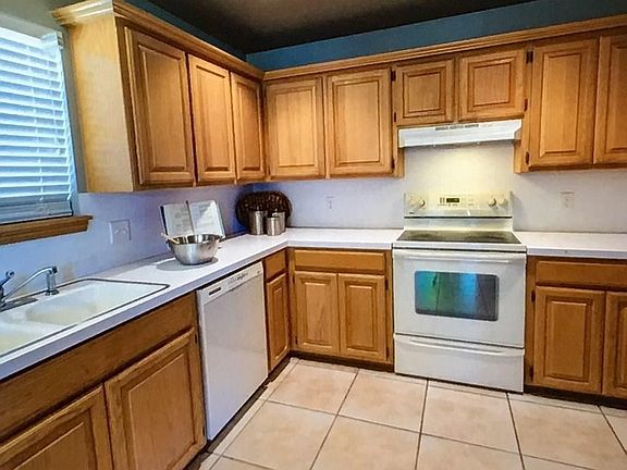 Nice open kitchen with lots of cabinet space and countertop space.