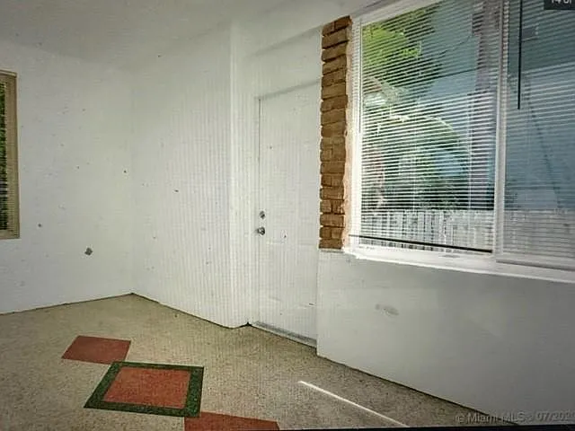 second bedroom - den or office - approx 7 x 15 with picture window of outdoor yard and private entrance