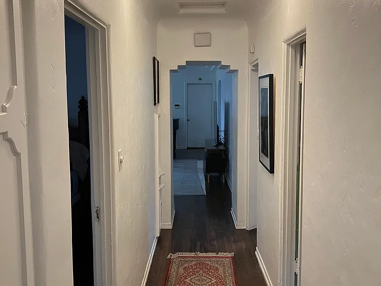 Note unique plaster work in doorway. The door in the background leads directly into closed 2 car garage.