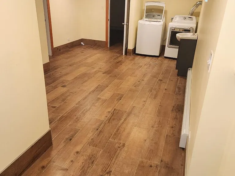 Basement main room looking towards washing machines