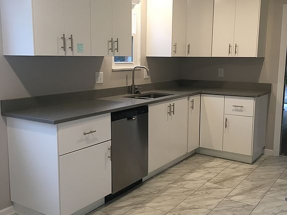 Expansive cabinet space, quartz counter tops