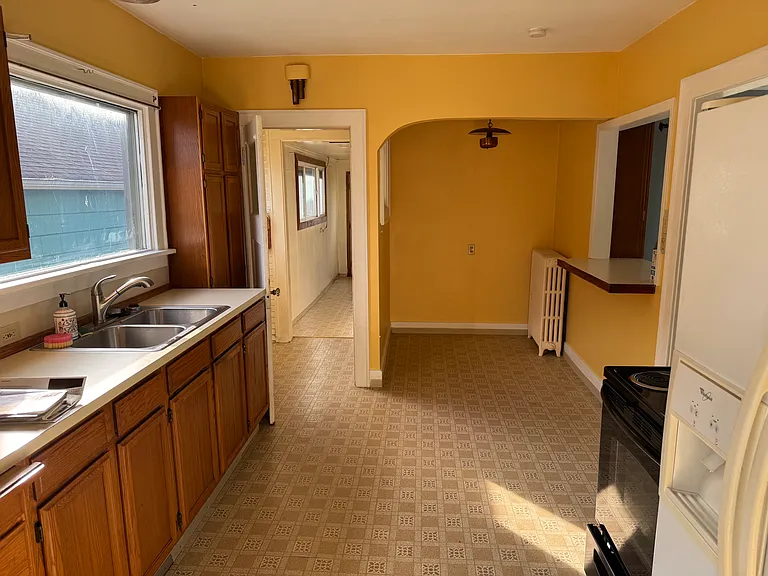 The kitchen comes with a range and fridge.