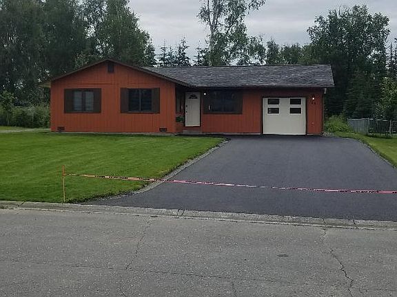 New paved driveway (7/2023) leading to heated garage.