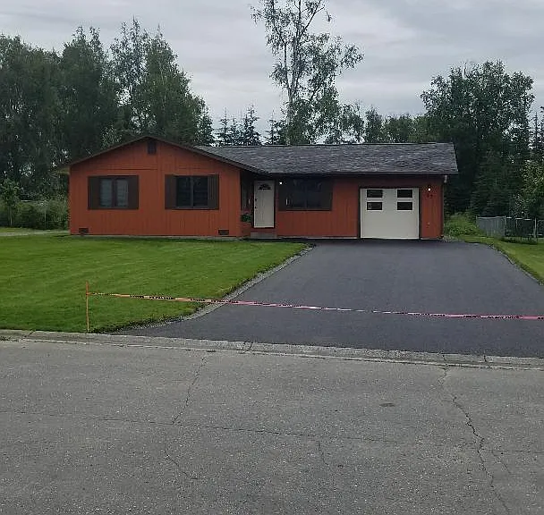 New paved driveway (7/2023) leading to heated garage.