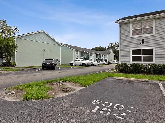 Front view with designated parking