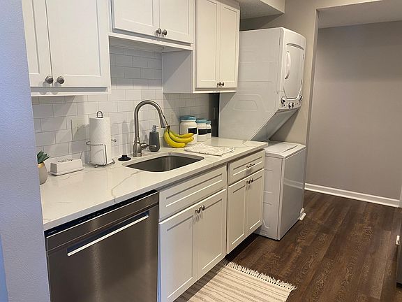 New white cabinets, new appliances and carerra marble countertops.
