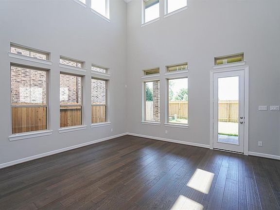 Gorgeous wood floors adorn the entry, study, family room, dining room, and kitchen.