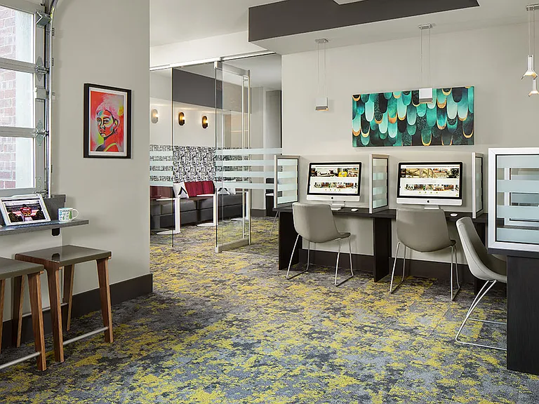 Apartment community business center with MAC work stations at Griffis North Union in Denver, Colorado.