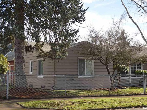 Fully fenced front and side yard on corner lot with access gates in front and side yard.