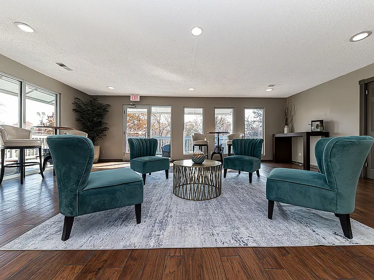 Experience relaxation in this beautifully designed lounge featuring modern decor and abundant natural light.