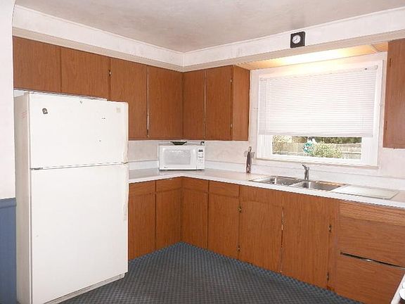 Kitchen, also, includes refrigerator