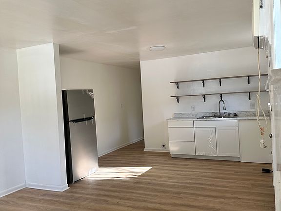newly renovated kitchen, comes with refrig and stove. 
Also has washer and dryer hook ups.