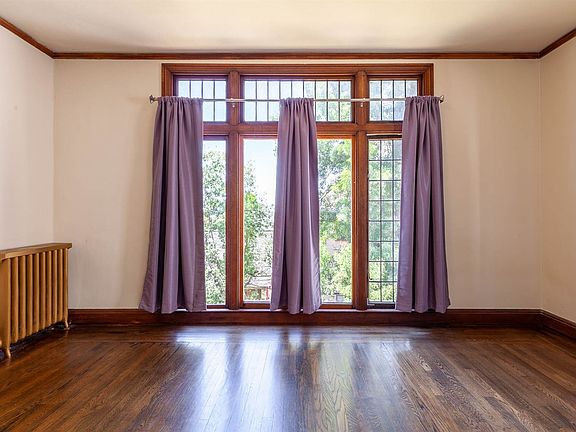 First bedroom off the living room. Floor to ceiling windows