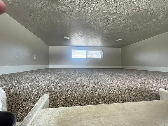 Loft area. You can sit in loft, but not stand. About 4 feet tall.