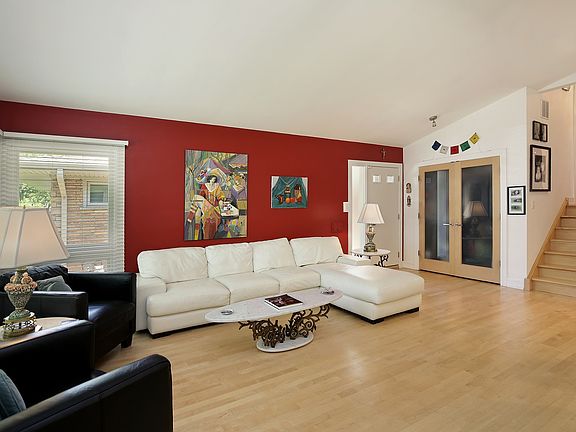 Spacious living room with hardwood flooring.