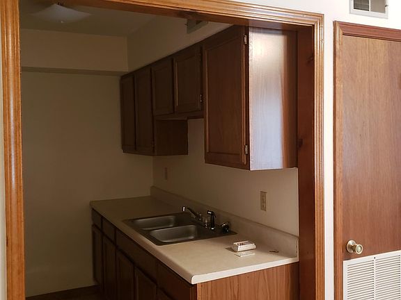 Kitchen showing double sink and some of the cabinets.