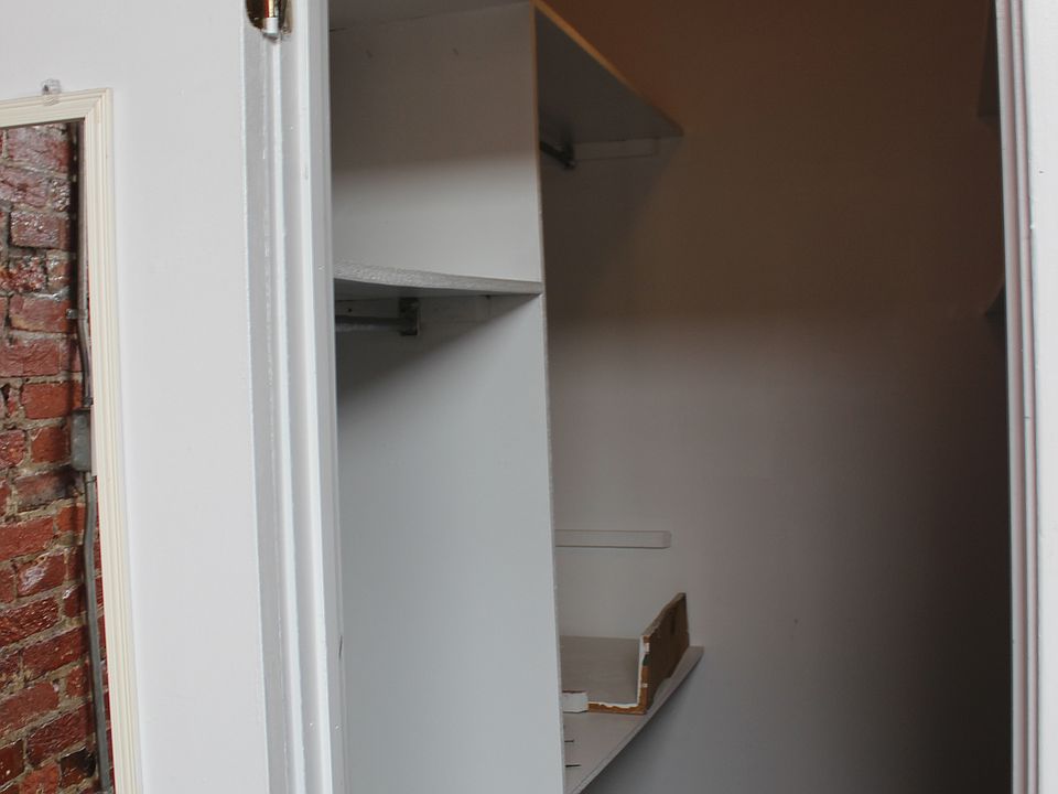Huge walk in closet with plenty of storage.