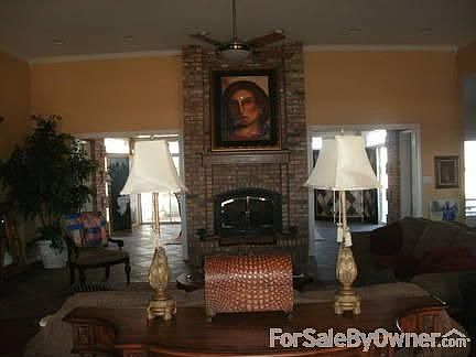 beautiful brick fireplace
						:
						open living/kitchen area - crown molding thru out entire house 18 in tile floors