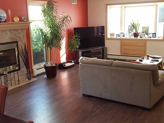 Family Room w/ vaulted ceiling and Fireplace