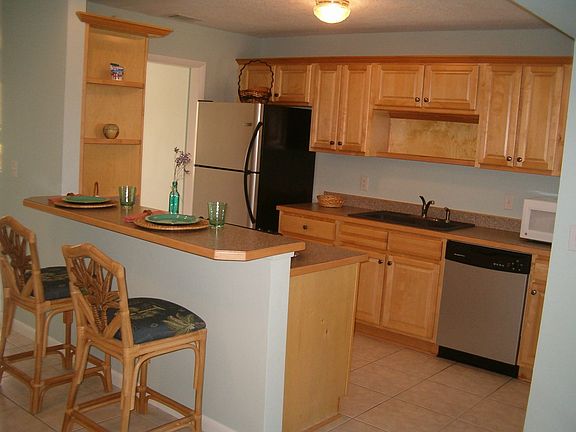 Maple hardwood cabinets in light and airy kitchen - 2-years new!
