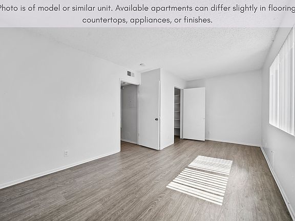Bright bedroom featuring a comfortable layout and convenient closet storage.